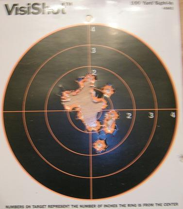 [Target riddled with holes from reloads.]