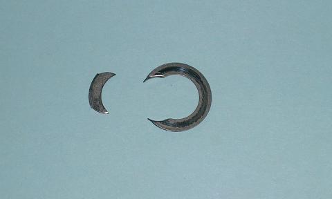 [Rocker thrust-washer that was neatly *punched* with the shaft.]
